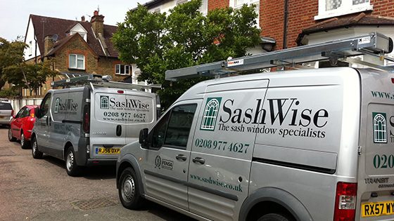 Sashwise vans parked outside of a house